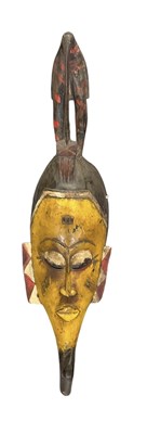 Lot 1129 - An African Guro yellow, white and red painted...