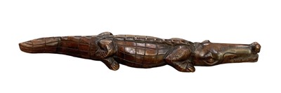 Lot 1124 - An African carved wooden crocodile, length 72cm.