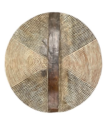 Lot 1125 - A large African carved wooden tribal shield,...
