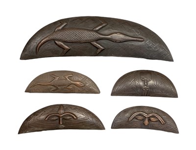Lot 1056 - Five African carved wooden crescent shaped...