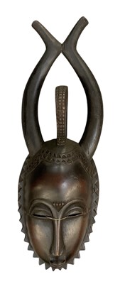 Lot 1121 - An African carved wooden mask, possibly Yaure,...