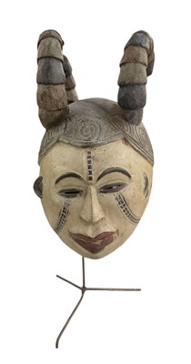 Lot 1045 - An African carved wooden Igbo maiden mask, on...