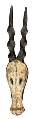 Lot 1060 - An African carved wooden antelope mask,...