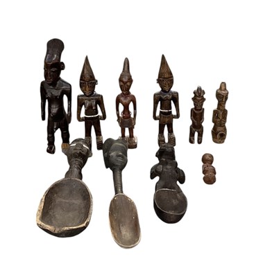 Lot 1019 - A collection of six African carved wooden...
