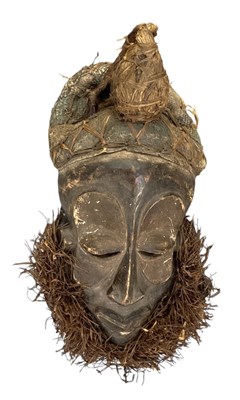 Lot 1117 - An African carved wooden Dan tribe mask, with...