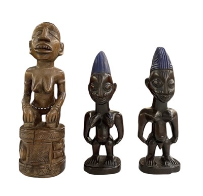 Lot 1061 - An Ibeji carved wooden female figure, height...