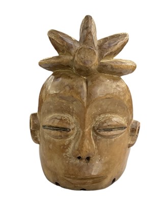 Lot 1115 - An African carved wooden tribal mask, height...