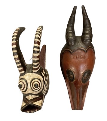 Lot 1063 - A carved wooden and painted Burkina Faso mask,...