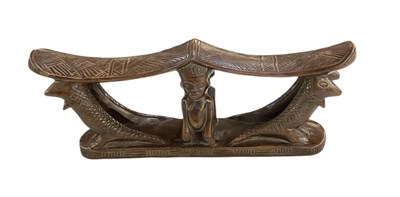 Lot 1062 - An African carved wooden Kuba headrest, with...