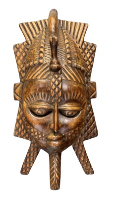 Lot 1112 - A large African carved wooden wall hanging and...