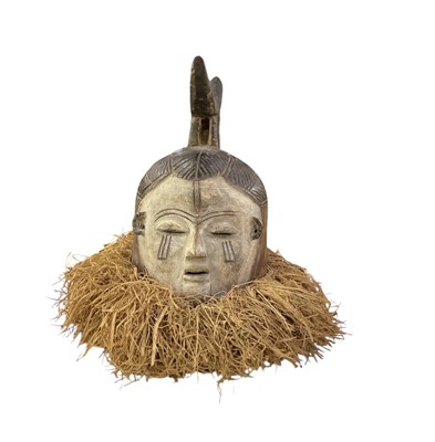 Lot 1064 - An African carved wooden Suku mask, with straw...