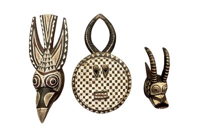 Lot 1039 - Three African carved wooden Burkina Faso masks,...