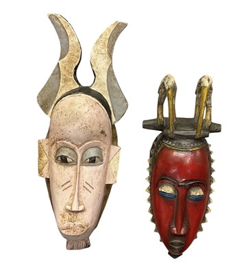 Lot 1104 - An African carved wooden red painted Yaure...