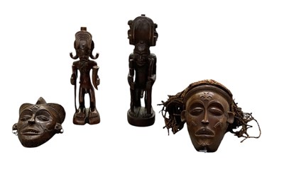 Lot 1071 - Two African carved wooden Chokwe masks, the...
