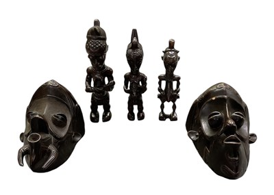 Lot 1040 - Two African carved wooden Lalua masks, both...