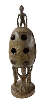 Lot 1041 - An unusual African carved wooden egg shaped...