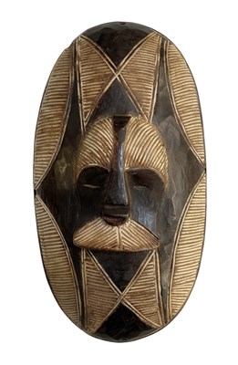 Lot 1111 - A small African carved wooden Songye shield,...