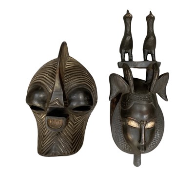 Lot 1067 - An African carved wooden Songye mask, height...