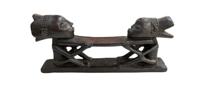 Lot 1108 - An African carved wooden double Luba headrest,...