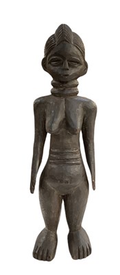 Lot 1109 - An African carved wooden freestanding female...