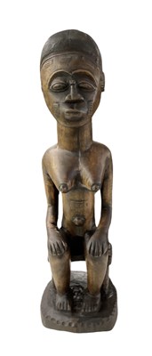 Lot 1080 - An African carved wooden Baule/Guro seated...
