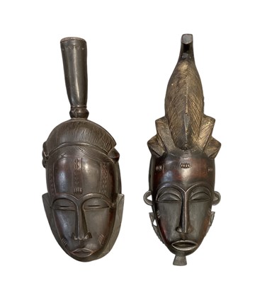 Lot 1094 - Two African carved wooden Baule masks, both...