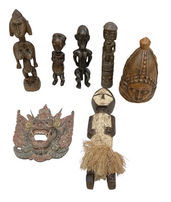 Lot 1030 - An African carved wooden white painted figure...