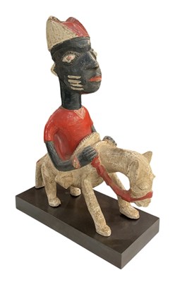 Lot 1031 - A carved wooden Yoruba horse rider, on...