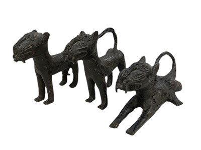 Lot 1077 - Two Benin bronze standing leopards and a Benin...