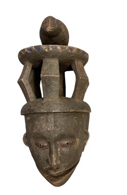 Lot 1078 - An African carved wooden Yoruba mask, with...