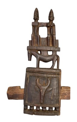 Lot 1098 - An African carved wooden Dogon door lock, with...