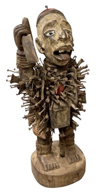Lot 1073 - An African carved wooden Nkisi nail fetish...