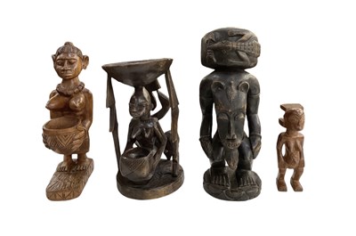 Lot 1035 - An African carved wooden figural pot, height...
