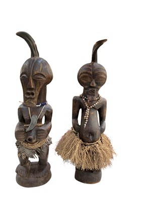 Lot 1023 - A pair of large African carved wooden Songye...