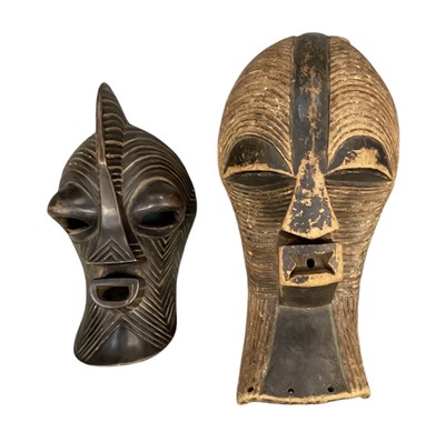 Lot 1076 - A large African carved wooden Songye mask,...