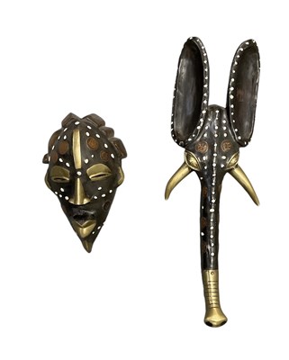Lot 1100 - An African carved wooden elephant mask,...
