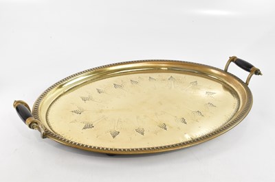 Lot 2642 - A large oval twin handled brass tray, width 69cm.