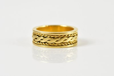 Lot 1317 - An 18ct broad yellow gold wedding band, size K,...