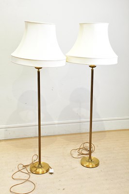 Lot 2657 - A pair of decorative brass standard lamps with...