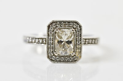 Lot 56 - A 14ct white gold diamond ring, the central...