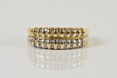 Lot 1344 - A 14ct yellow and white gold diamond set ring...