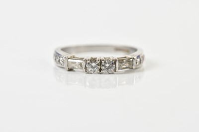Lot 1345 - An 18ct white gold and diamond ring set with...