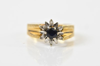 Lot 1453 - An 18ct yellow gold sapphire and tiny diamond...