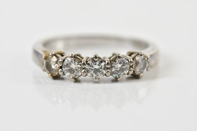 Lot 1343 - An 18ct white gold diamond five stone ring,...