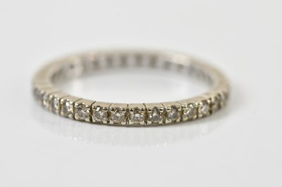 Lot 130 - A white metal diamond set full eternity ring,...
