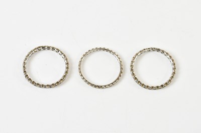 Lot 1315 - A group of three white metal diamond set full...