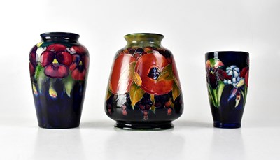 Lot 268 - MOORCROFT; three vases, comprising a...