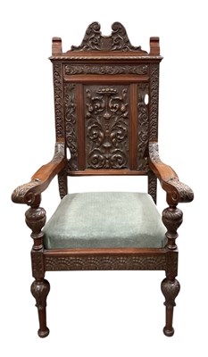 Lot 27 - A 19th century heavily carved walnut armchair,...