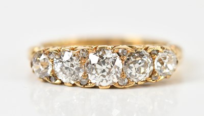 Lot 1297 - An 18ct yellow gold five stone graduated...