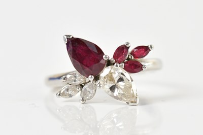 Lot 1291 - A white metal ruby and diamond dress ring, the...